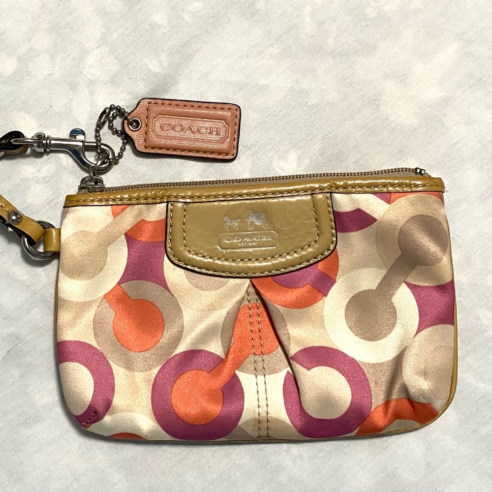 Coach Optic C Colorful Patterned Wristlet
Orange pink cream. Patent Leather - Picture 2 of 11